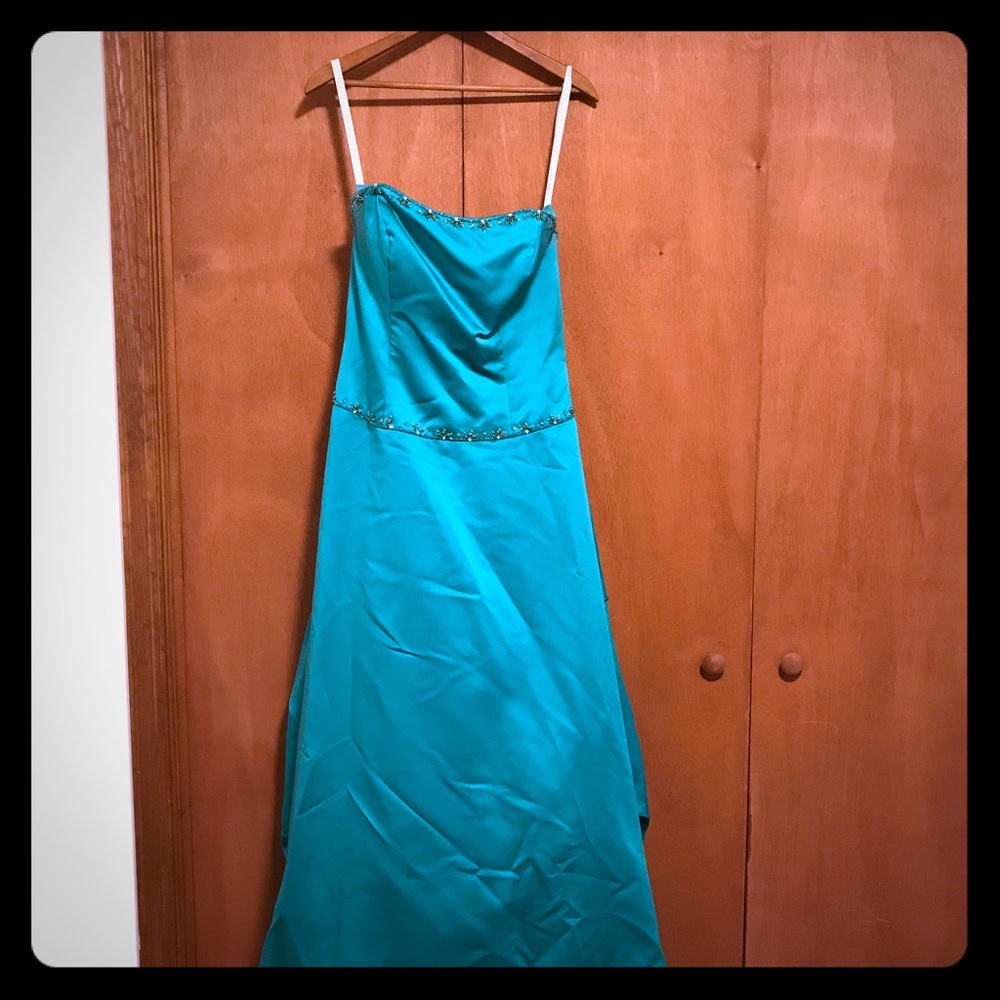 Teal prom dress with bustled back.